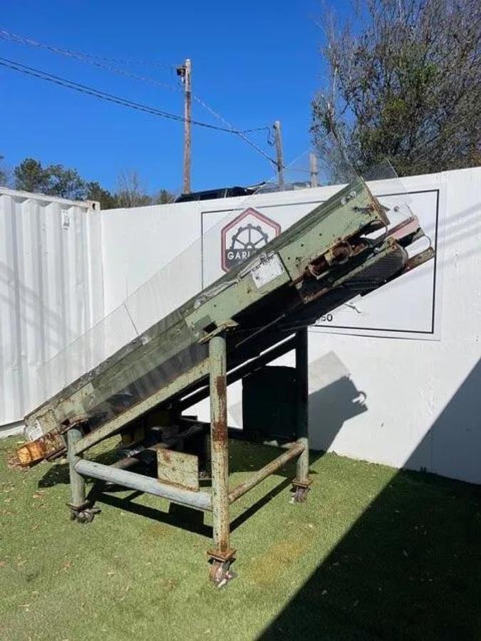 Used Conveyor Belt W: 28", L: 9'8" Cleated Incline w/ Leeson 2 HP at 1740 RPM