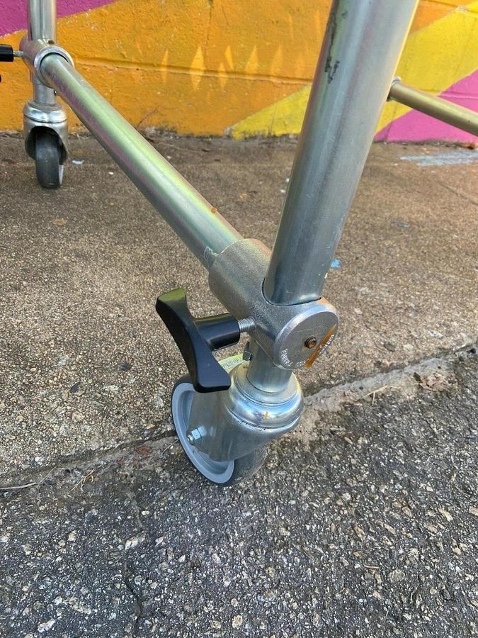 Used Matrex 89500 Portable Expandable Roller Conveyor, 6’ to 15’, On Casters