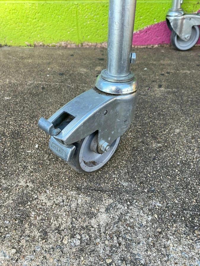 Used Matrex 89500 Portable Expandable Roller Conveyor, 6’ to 15’, On Casters