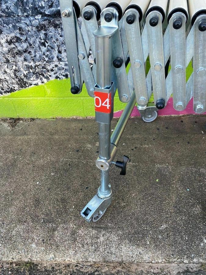 Used Matrex 89500 Portable Expandable Roller Conveyor, 6’ to 15’, On Casters