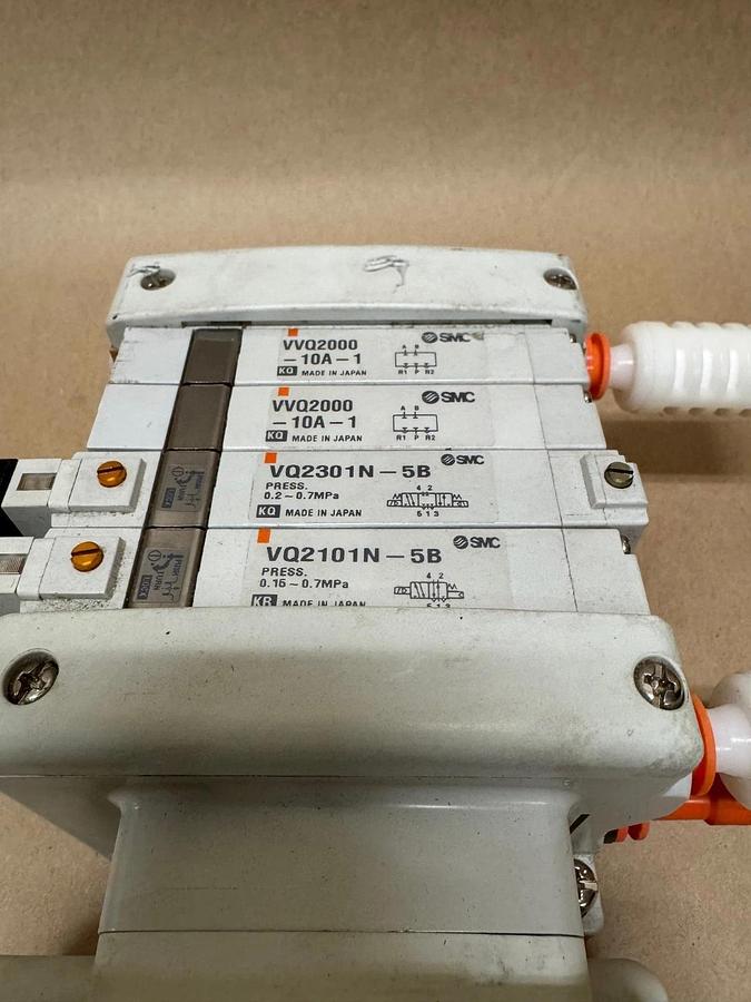 Used SMC 4-Slot Pneumatic Manifold (2) VVQ2000-10A-1 (1) VQ2301N-5B (1) VQ2101-5B