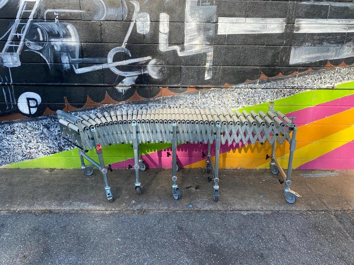 Used Matrex 89500 Portable Expandable Roller Conveyor, 6’ to 15’, On Casters