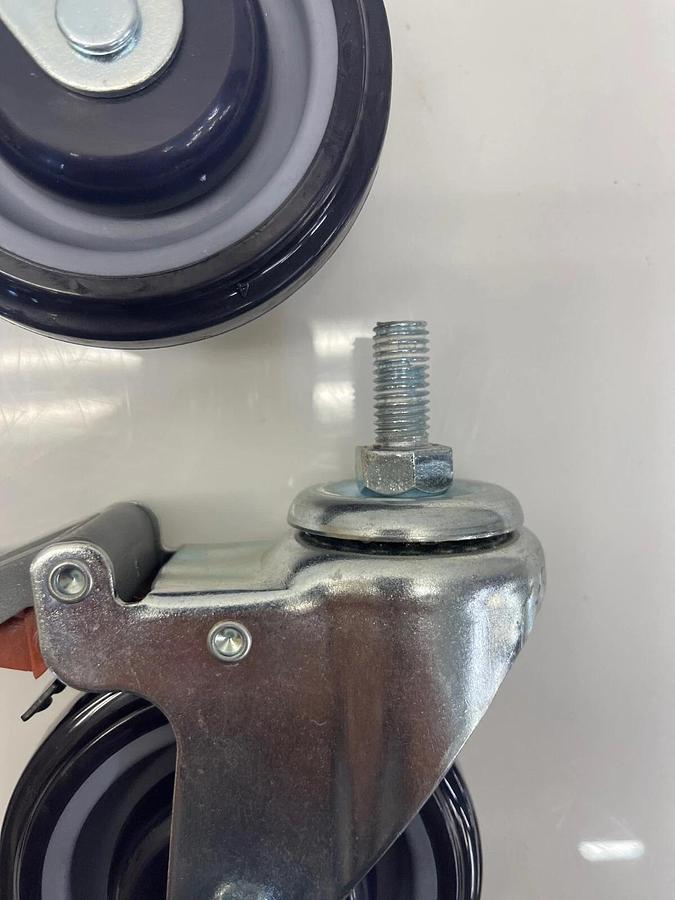 Used Globe 4" Caster Swivel Lock Med Duty 1” Tall Stem 1/2” Thread Polyurethane Wheel