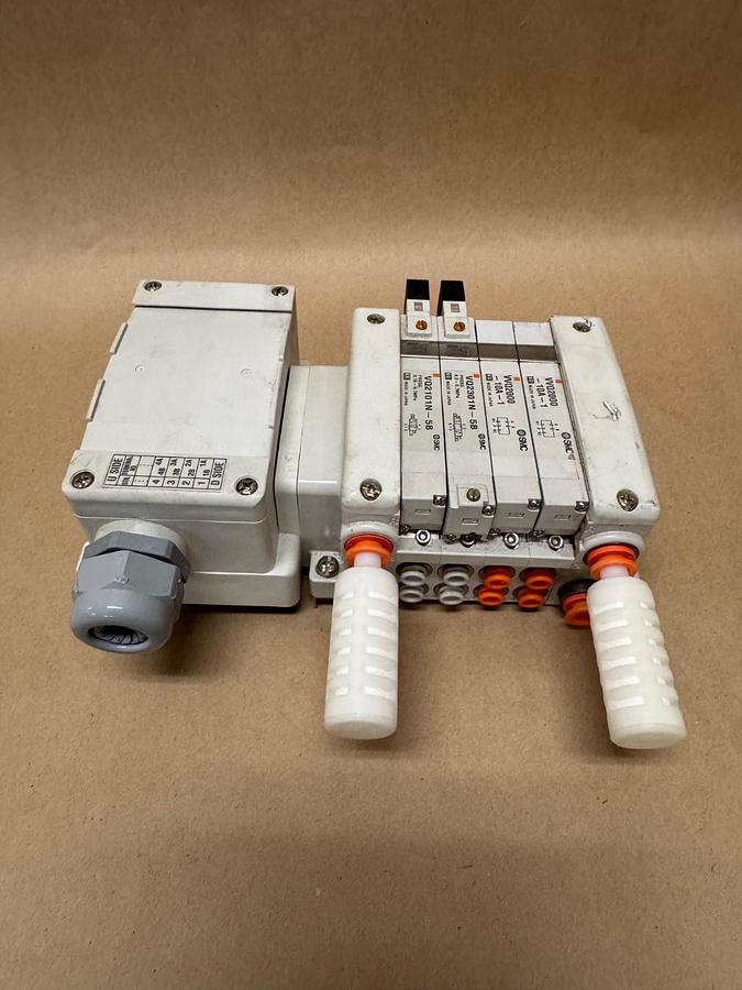 Used SMC 4-Slot Pneumatic Manifold (2) VVQ2000-10A-1 (1) VQ2301N-5B (1) VQ2101-5B
