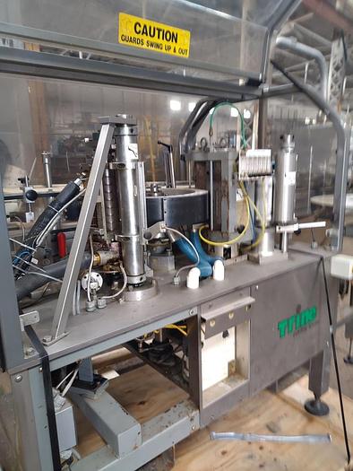 Used TRine 4500 roll fed labeler - hot melt