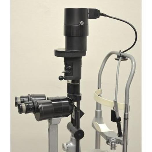 Used HAAG STREIT BM 900 SLIT LAMP WITH THREE-DIMENSIONAL MOVEMENTS, ON ITS VARIABLE HEIGHT TABLE
