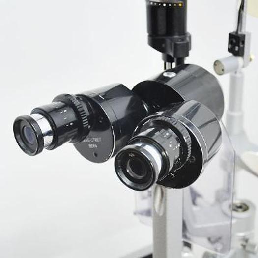 Used HAAG STREIT BM 900 SLIT LAMP ON HEIGHT-ADJUSTABLE TABLE