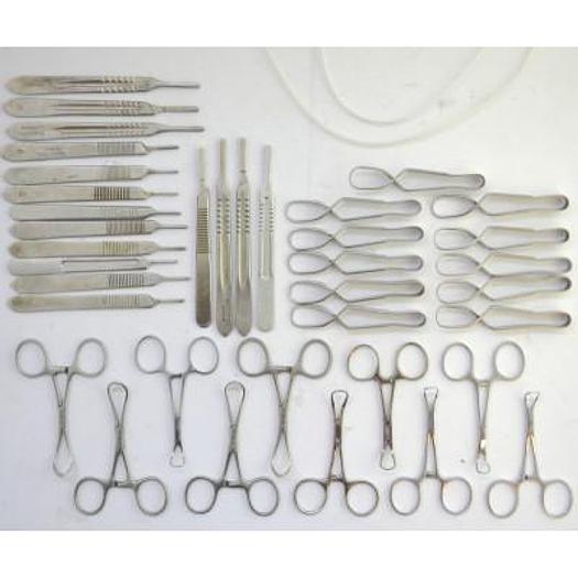 Used BOX WITH VARIOUS HEART-SHAPED PLIERS, BULLDOG, SCALPELS, ETC...