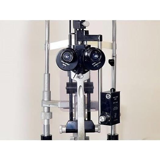 Used HAAG STREIT 900 SLIT LAMP WITH THREE-DIMENSIONAL MOVEMENTS, ON ITS HEIGHT-ADJUSTABLE TABLE