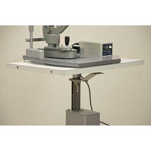 Used MAGNON SLIT LAMP WITH THREE-DIMENSIONAL MOVEMENTS AND LEVELLING TONOMETER, ON HEIGHT-ADJUSTABLE TABLE WITH CASTORS