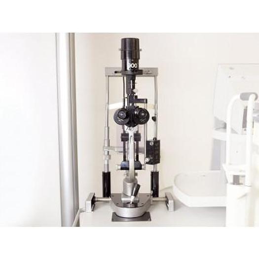 Used HAAG STREIT 900 SLIT LAMP WITH THREE-DIMENSIONAL MOVEMENTS, ON ITS HEIGHT-ADJUSTABLE TABLE