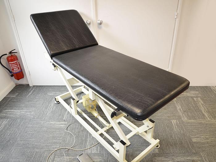 Used HENNING ELECTRIC EXAMINATION COUCH WITH TILTING HEADREST