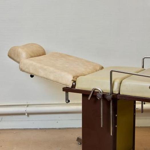 Used GYNECOLOGICAL EXAMINATION COUCH WITH STIRRUPS AND HEADREST