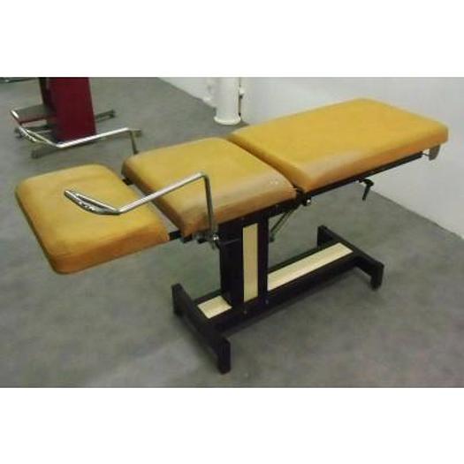 Used GYNECOLOGICAL EXAMINATION COUCH WITH STIRRUPS AND ADJUSTABLE LEG PLATE