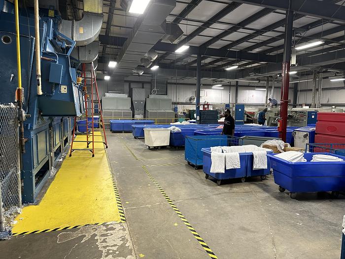 Used Milnor CBW system dryers (5 available) with Autolint