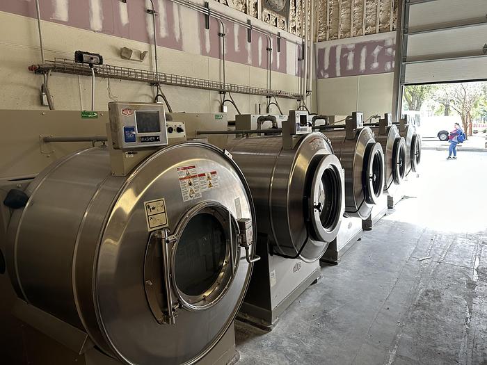 Used Milnor 140lb washer extractors (5 available)