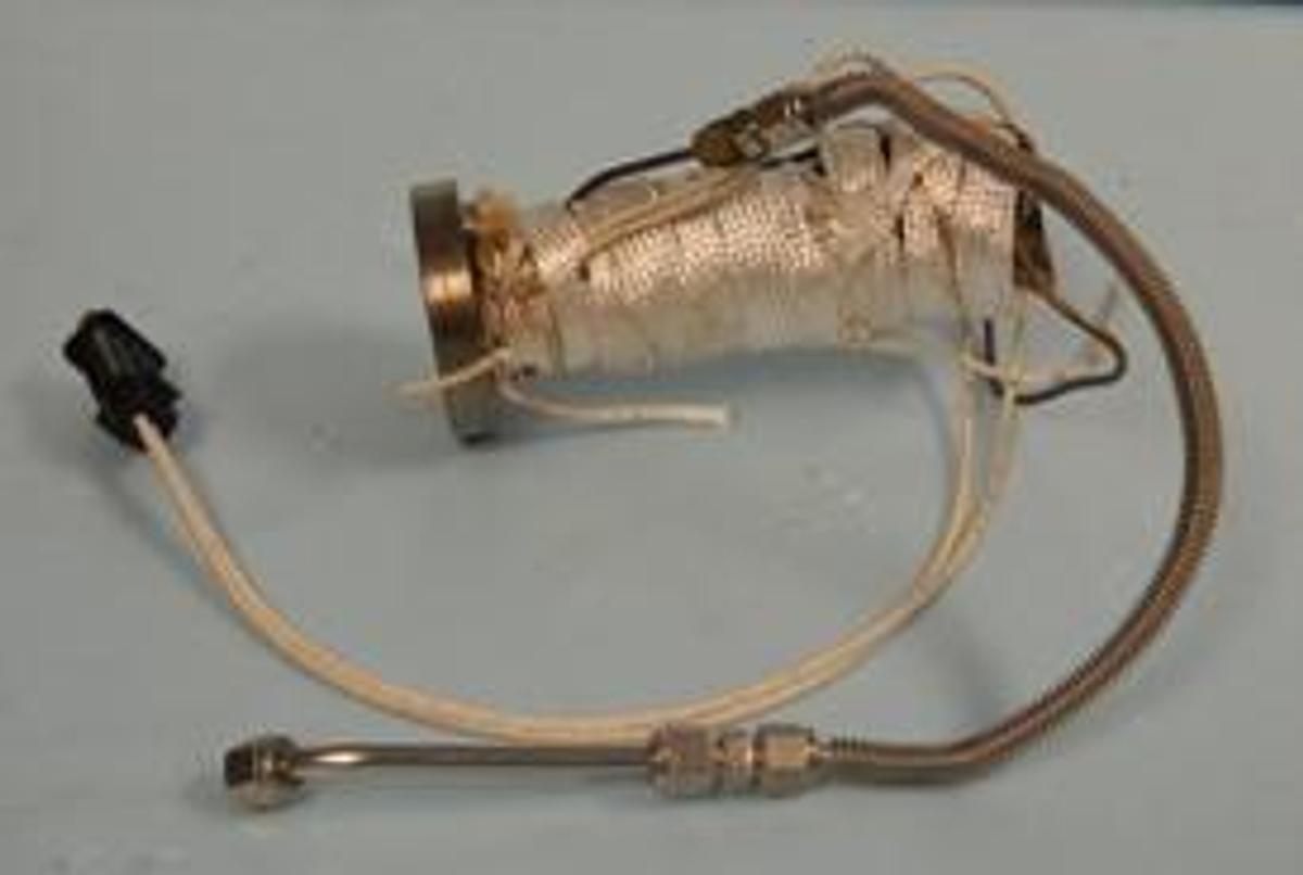 Used QTY. 1. STAINLESS STEEL REACTOR 200 ML. WITH EXTERNAL HEATING / COOLING COIL AND ELECTRIC THERMO TAPE WRAPPED NO TOP. .