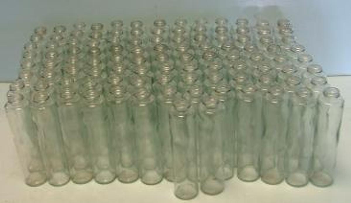 Used BOTTLES 4 OZ SAMPLE OIL BOTTLES.