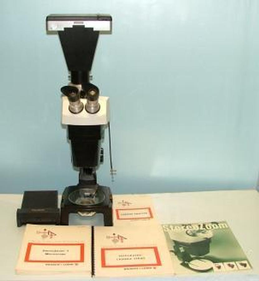 Used BAUSCH AND LOMB STEREO ZOOM MICROSCOPE WITH 3-1/4 X 4-1/4 CAMERA BODY WITH CAMERA LENS ASSEMBLY WITH VIEWFINDER EYEPIECE ADAPTER PLATE WITH FOCUSING TUBE AND SHUTTER ASSEMBLY WITH MANUALS.
