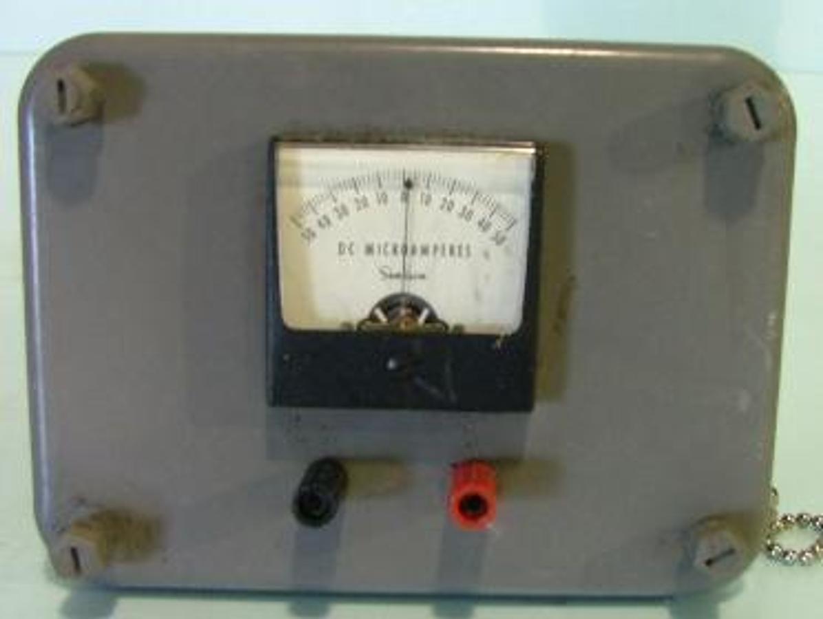 Used SIMPSON DC MICRO AMPERES METER-50-+50 ENCLOSED IN FIBERGLASS PLASTIC BOX..