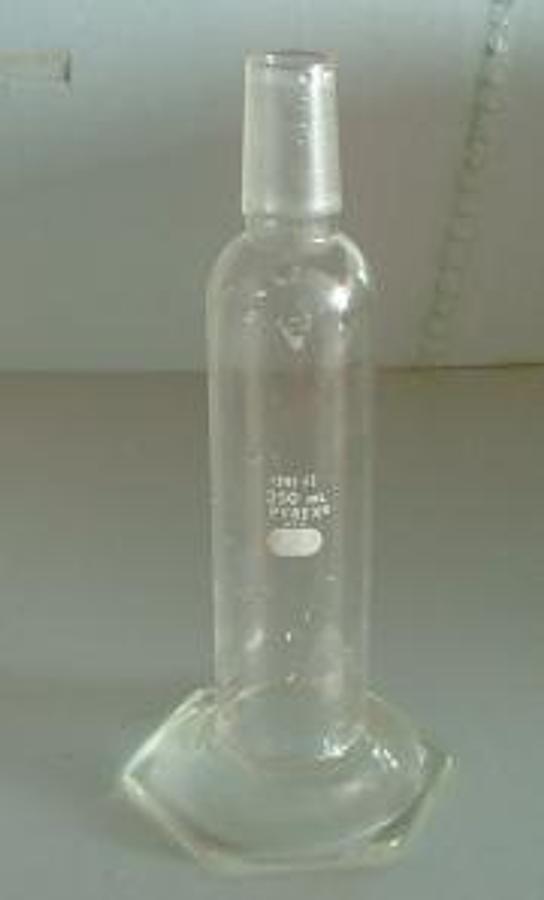Used PYREX 250 ML GRADUATED CYLINDER WITH 29/42 GROUND GLASS NECK. .