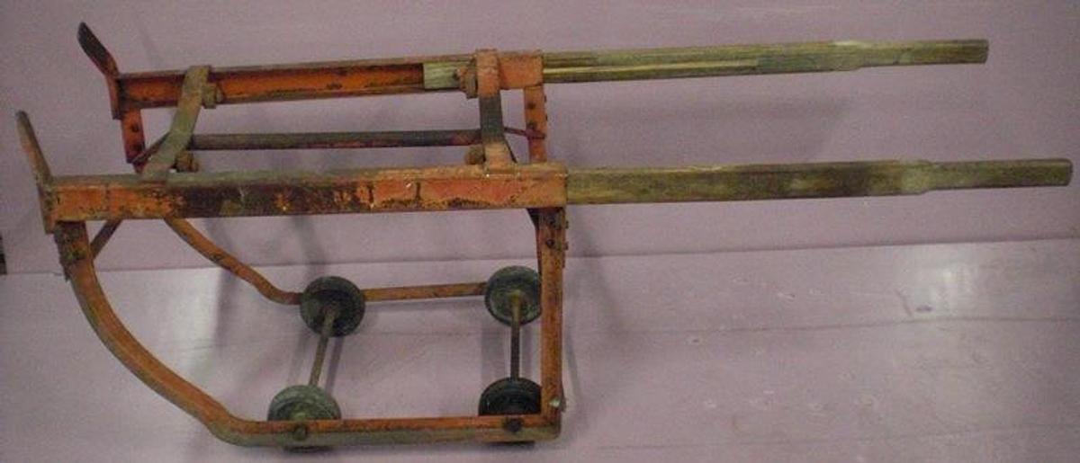 Used QTY. 1. 4 WHEEL 55 GALLON BARREL DOLLY WITH EXTENDABLE HANDLES.