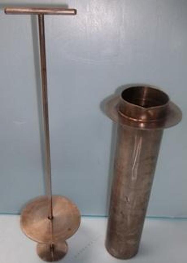 Used STAINLESS CUP 2 ½" WIDE X 12" DEEP WITH LIFT HANDLE FOR RETRIEVING OBJECTS OUT OF SOLUTION.