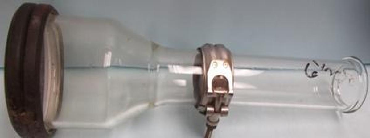 Used PYREX GLASS 4" GLASS REDUCER WITH 6 ½" LONG 2" PIPE BEADED ENDS.