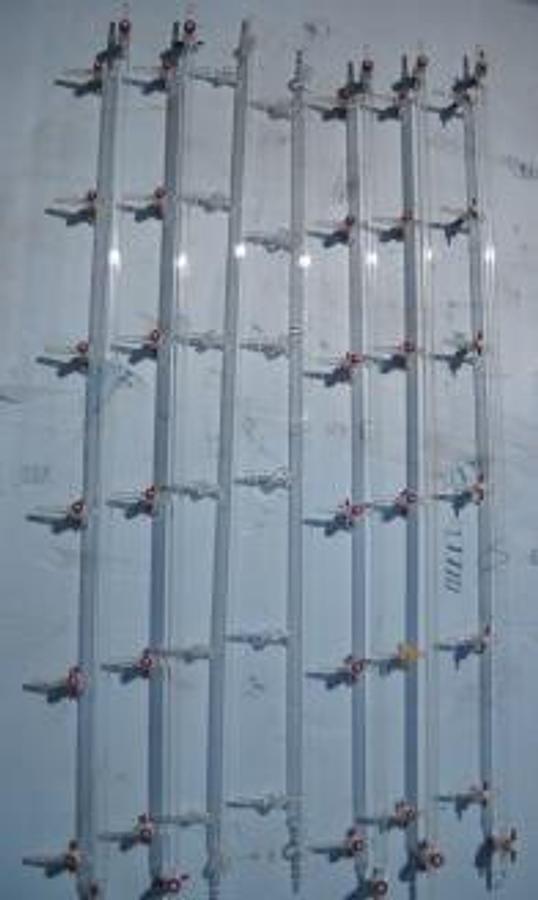 Used TITRATION TUBE WITH TUBE STOPCOCK OUTLET TUBED STOCK COCK INLET WITH SIX TUBE STOPCOCK SIDE INLETS.
