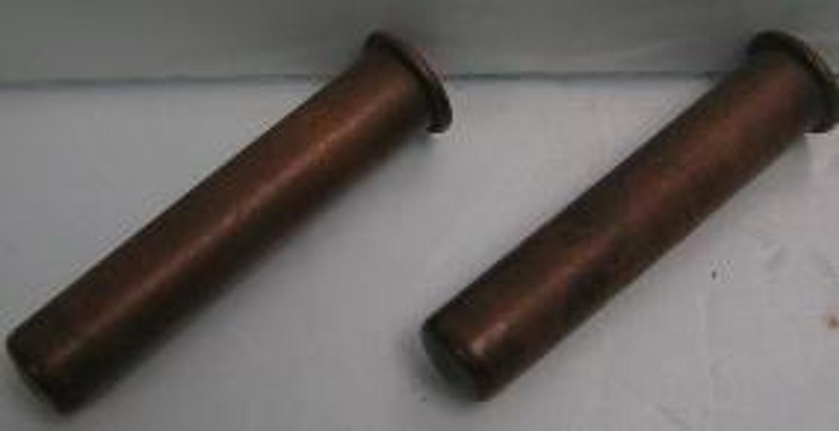 Used QTY. 2. BRASS CENTRIFUGE CUPS 11/16 OF AN INCH WIDE X 11/16 OF AN INCH DEEP.