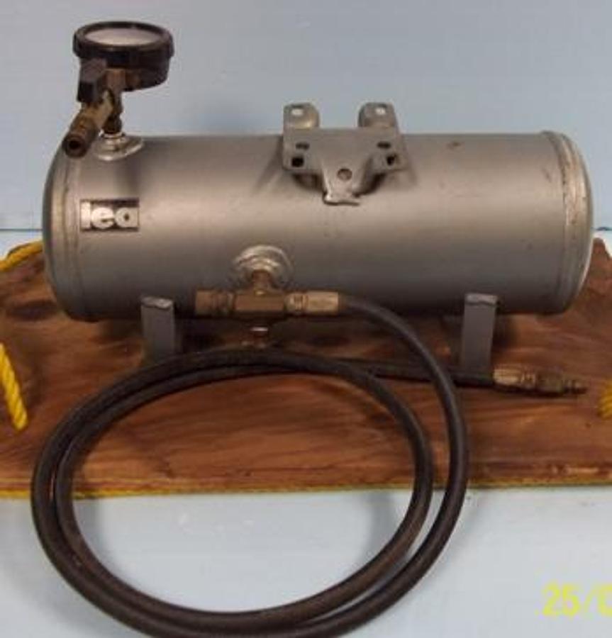 Used QTY. 1. IEA AIR TANK 17"X6" DIAMETER 0-200 PSI GAUGE BOLTED TO 14"X24" WOODEN BASE 6' AIR HOSE.