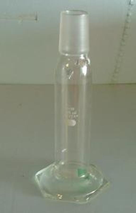Used PYREX 250 ML GRADUATED CYLINDER WITH GROUND GLASS 40/50 NECK. .