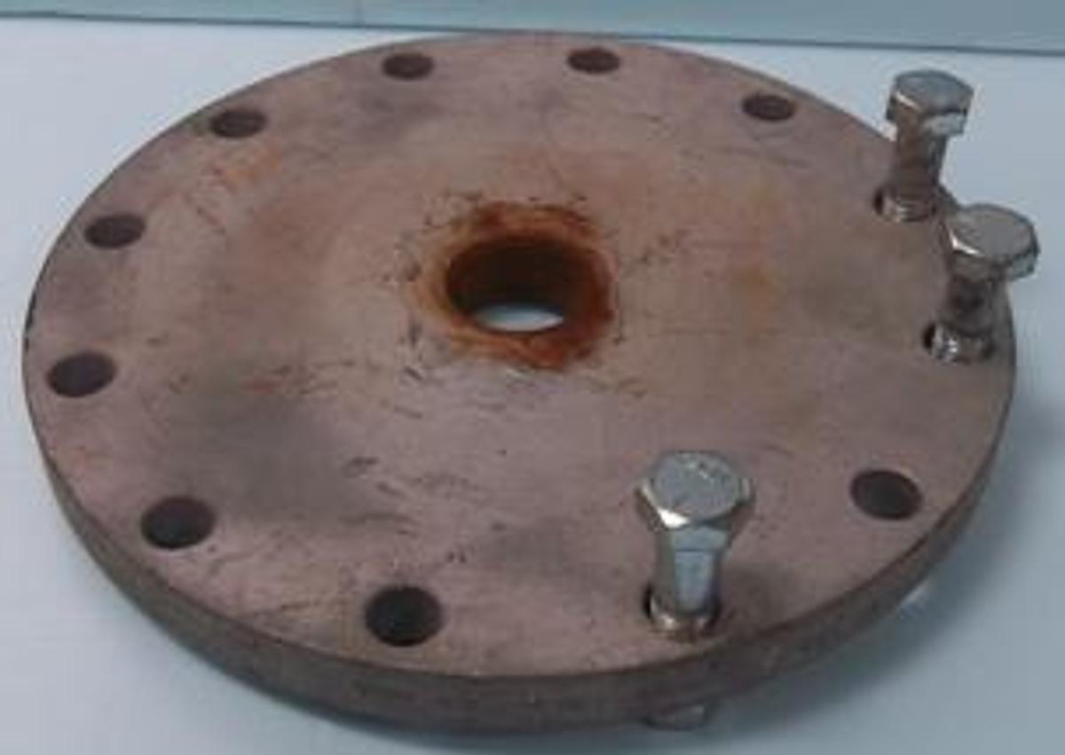 Used QTY. 1. 10" 150 STEEL BLIND FLANGE WITH 2" IPS THREADED HOLE IN CENTER.