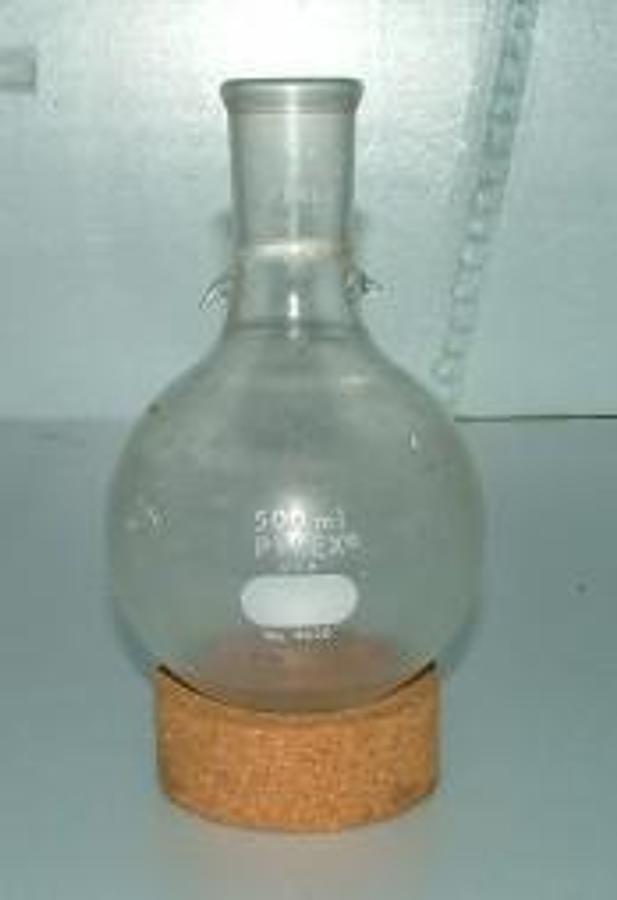 Used PYREX 500 ML ROUND BOTTOM BOILING FLASK WITH 29/42 NECK AND SPRING HOLDERS ON NECK.