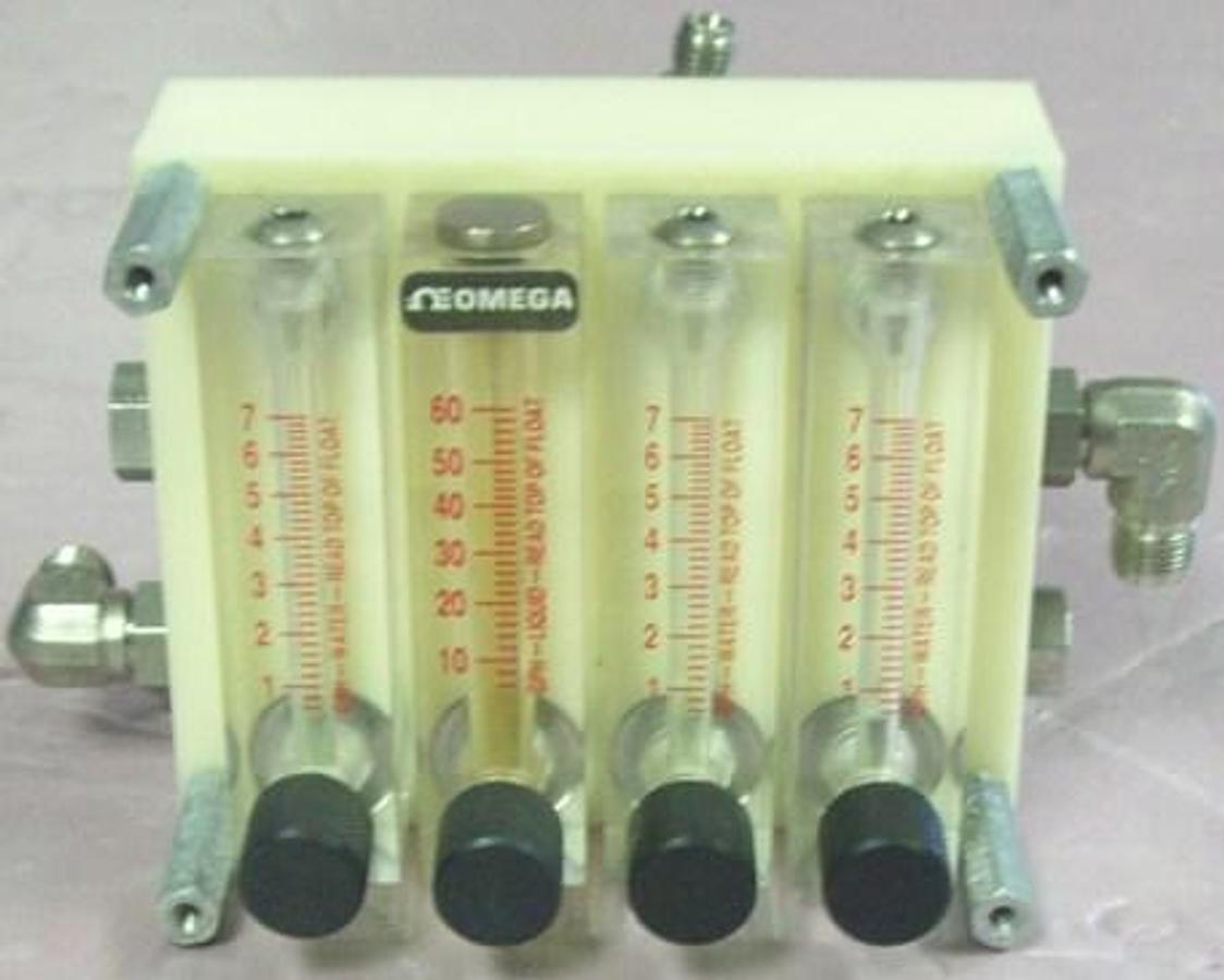 Used QTY. 1. A BLOCK WITH 4 OMEGA LIQUID/WATER FLOW METERS 3 READ 1 TO 7 GPH WATER 1 READS 10 TO 60 GPH LIQUID.