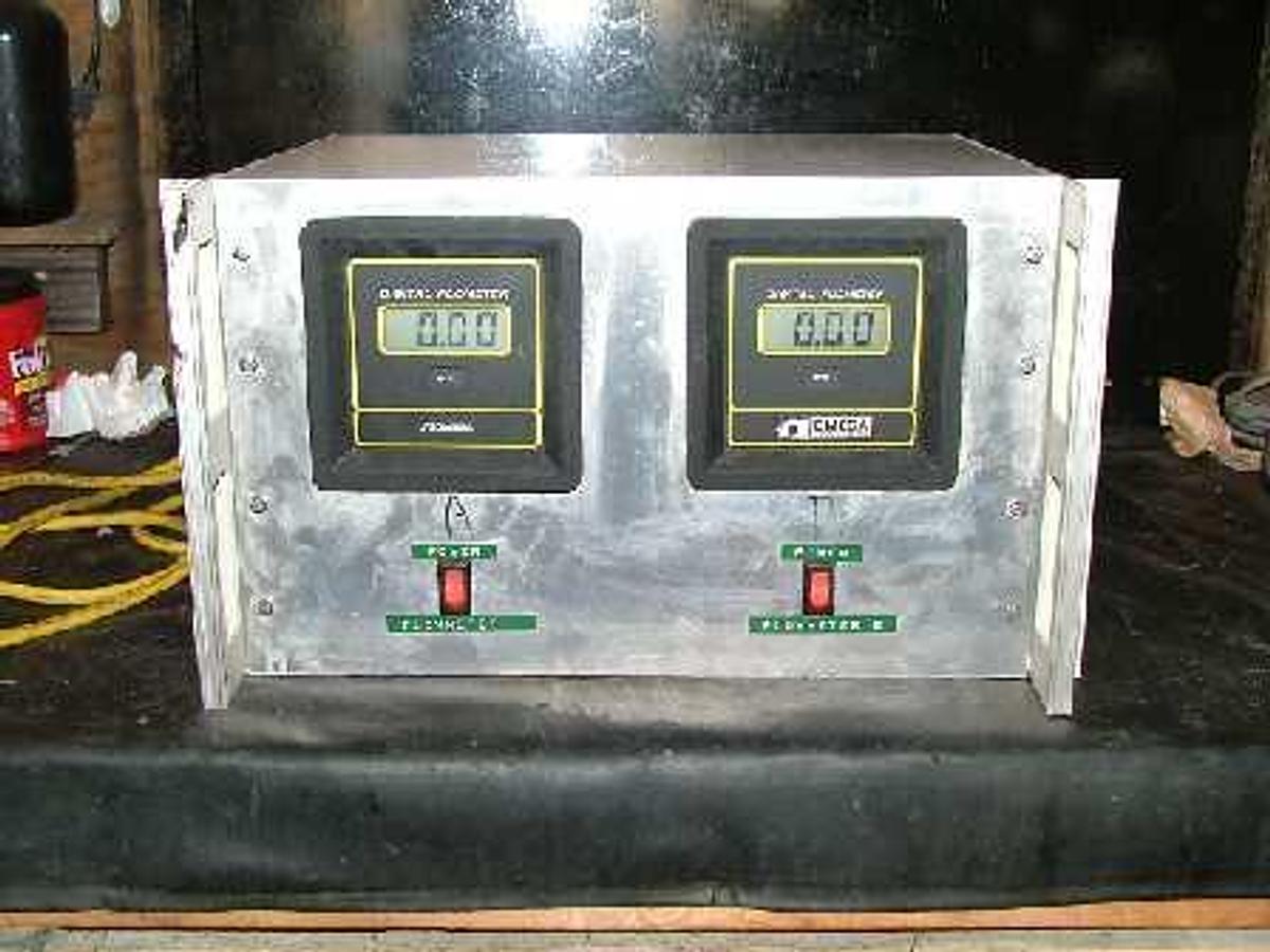 Used QTY. 2. OMEGA GPM DIGITAL FLOW METERS ENCLOSED IN A METAL BOX ENCLOSURE.