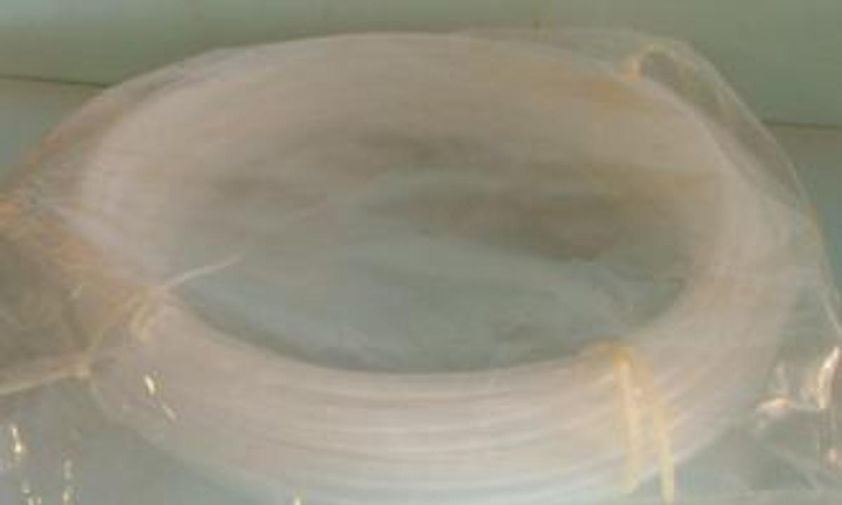 Used QTY. 1. TUBING CLEAR 100FT P/N AT500062-CH.