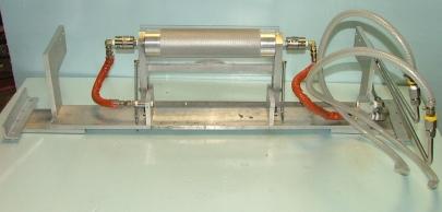 Used SHEET ROLL APPRATUS 3" X 13" WITH HIGH PRESSURE ROTARY UNIONS. ALUMINUM CONSTRUCTION WITH PLEXIGLASS GUARD.