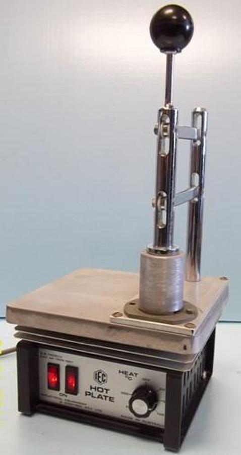 Used INDUSTRIAL EQUIPMENT AND CONTROL PTY LTD HOT PLATE C.S. 76083V CAT# 1922-001 300?C MAX TEMP WITH MANUAL TABLET PRESS MOUNTED ON IT.