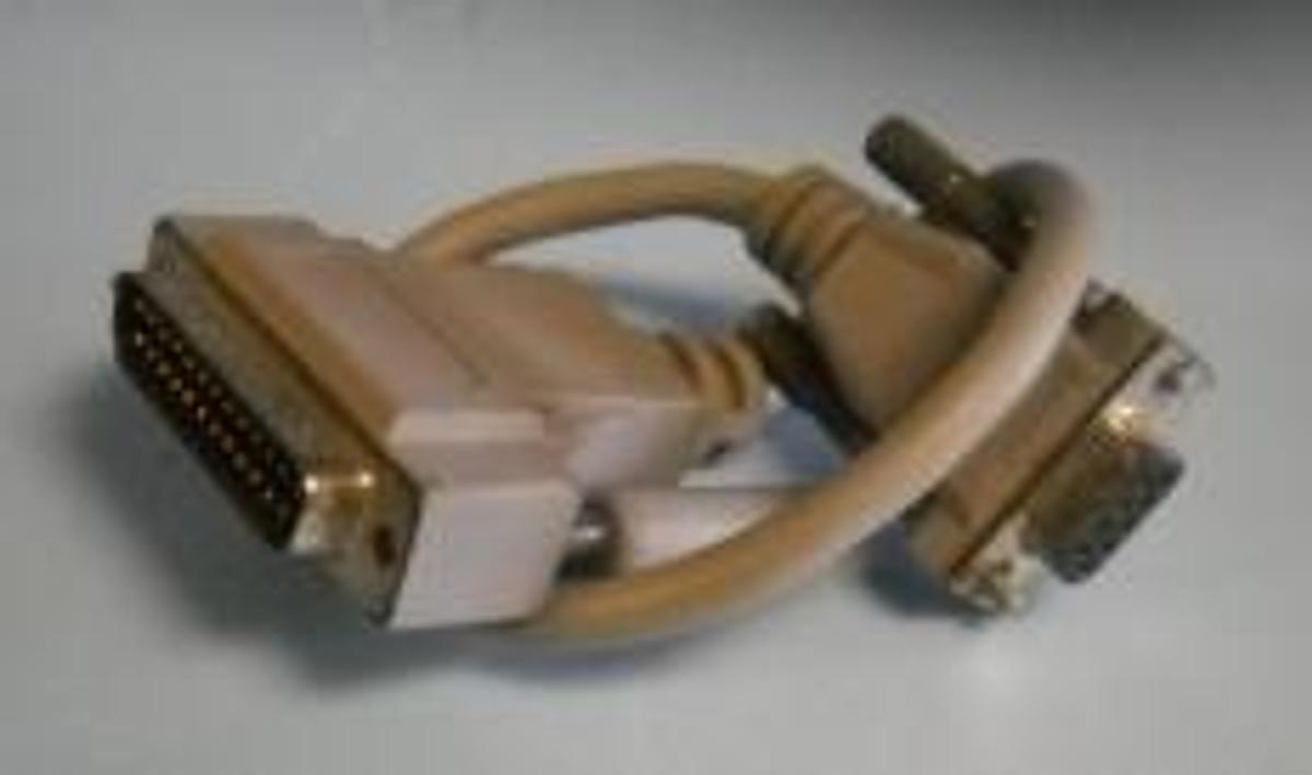 Used QTY. 1. EQUIPMENT CORD GREY 9 ½" 25 PIN MALE 9 PIN FEMALE.