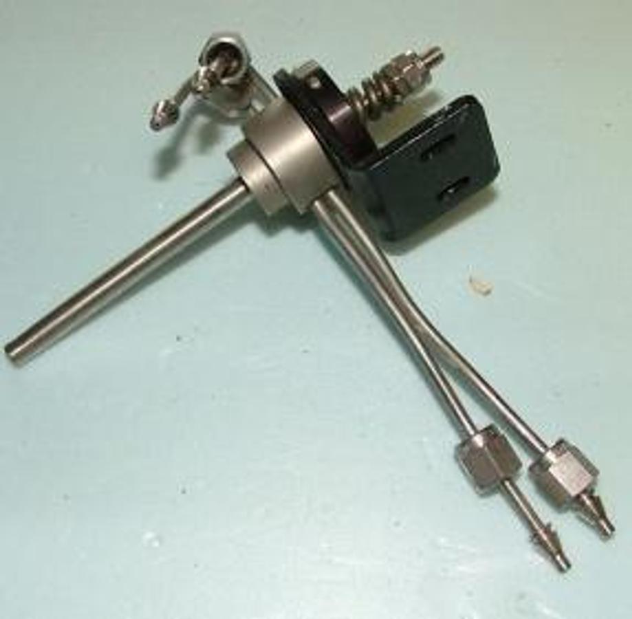 Used QTY. 1. VICI VALVE 4 PORT WITH FITTINGS AND BRACKET.