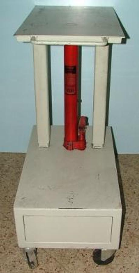 Used QTY. 1. WELL BUILT ROLL AROUND HYDRAULIC JACK TABLE