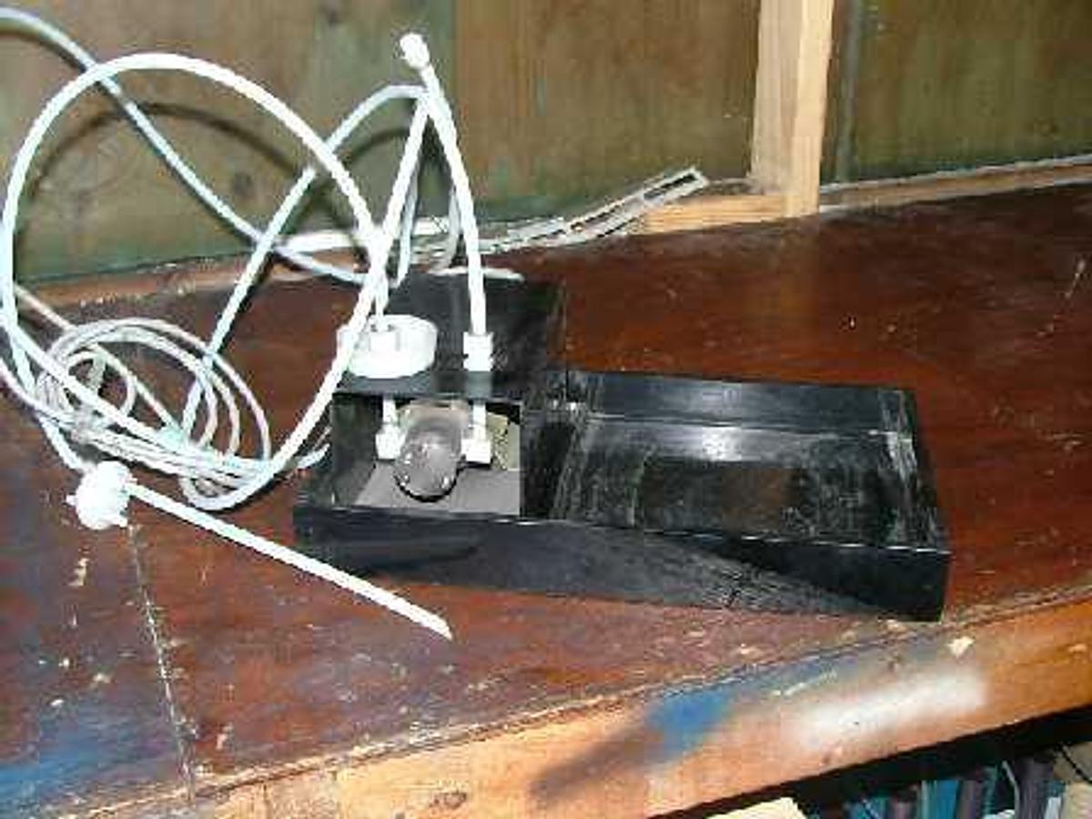 Used QTY. 1. IWAKI PUMP MOUNTED ON A PLASTIC STAND FOR A SQUARE JUG OR CAR BOY.